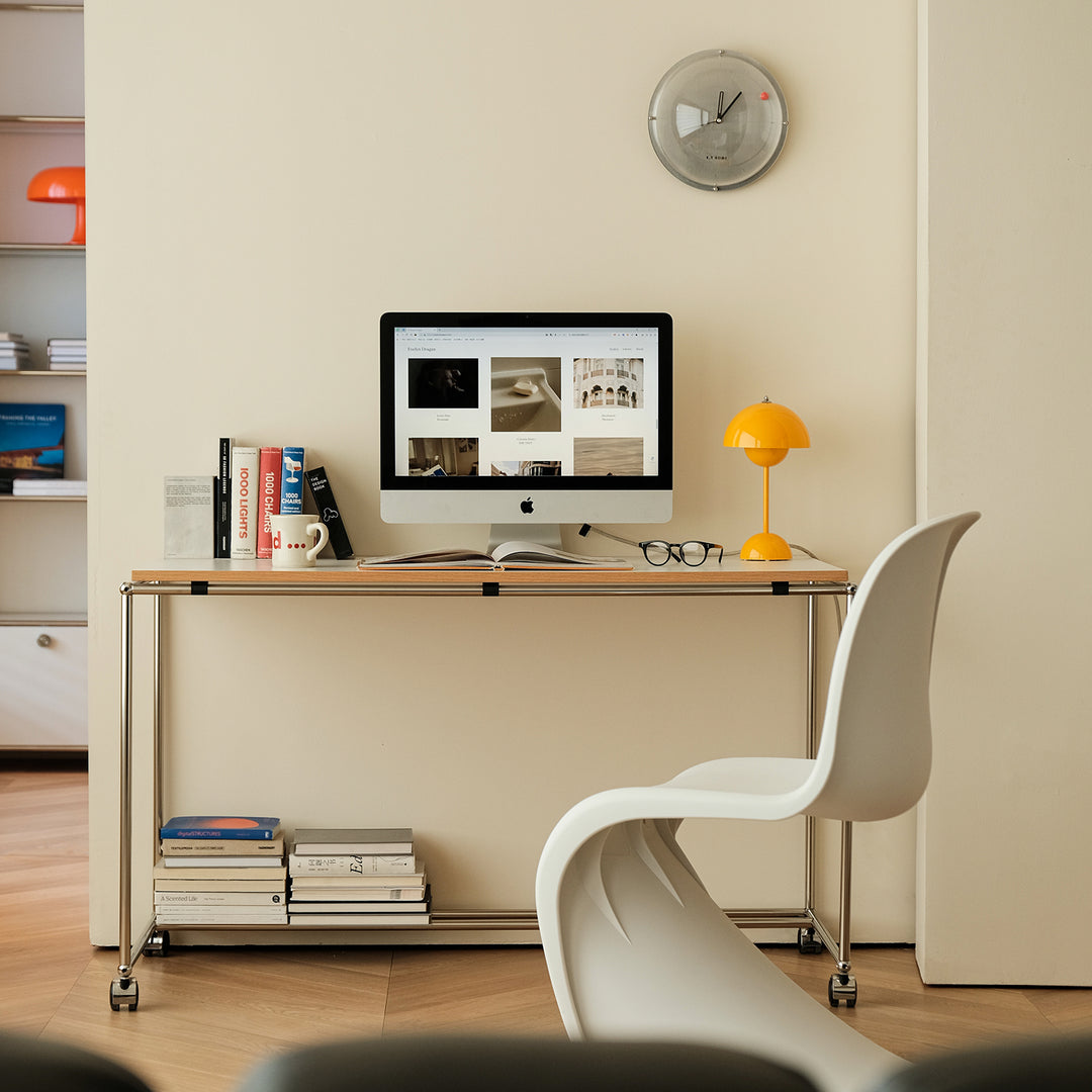 Minimalist steel wheeled study table usm in close up details.
