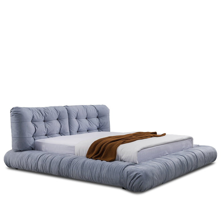 Minimalist suede fabric bed milano in white background.