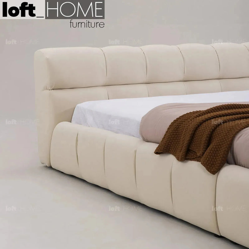 Bauhaus suede fabric bed tufty in still life.