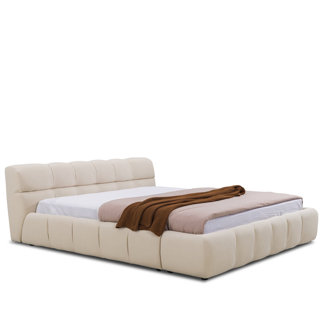 Minimalist suede fabric bed tufty in white background.