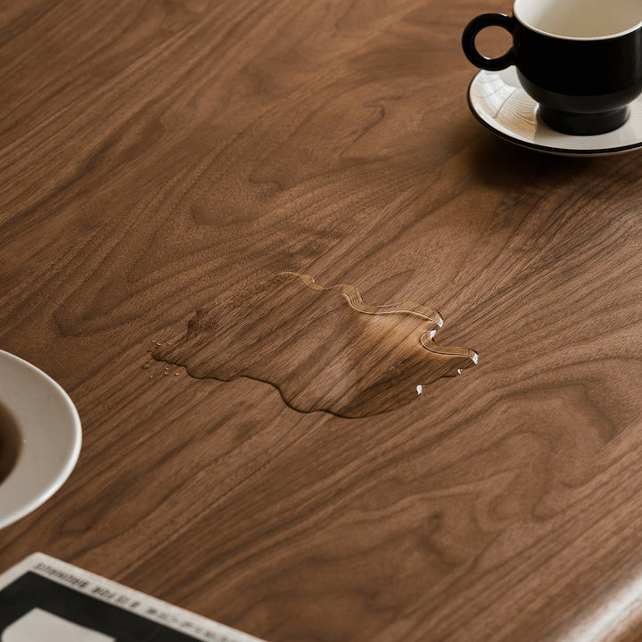 Mininalist walnut wood dining table conti in still life.