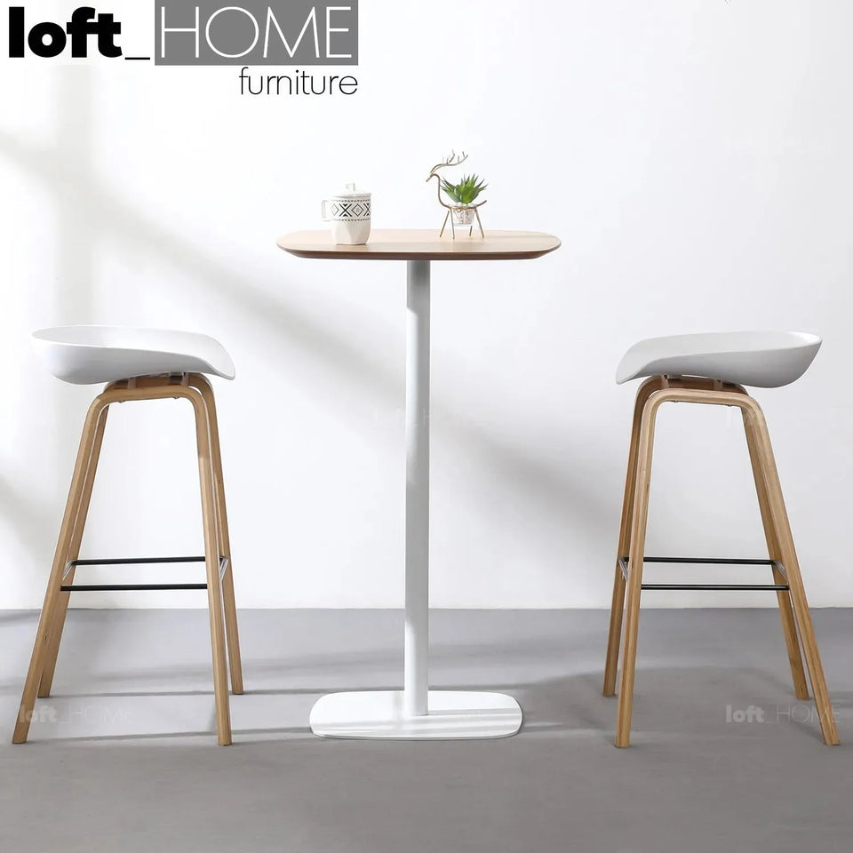 Minimalist wood bar table fane with context.