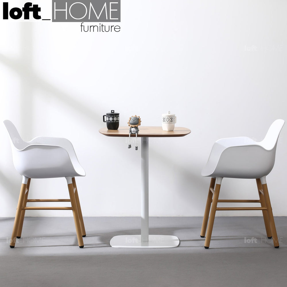 Minimalist wood dining table fane primary product view.
