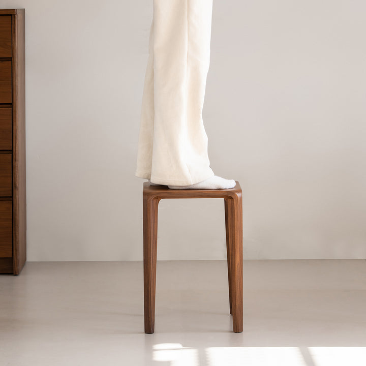 Minimalist walnut wood stool conti material variants.