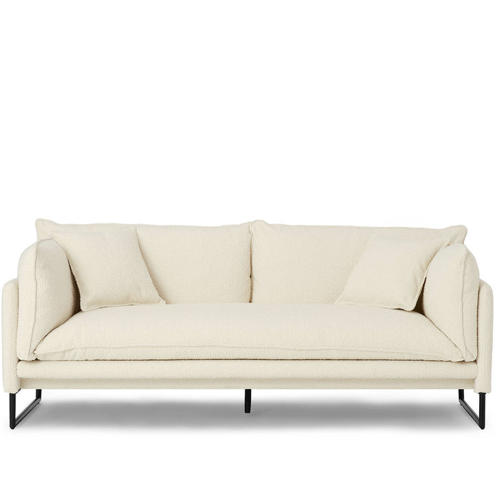 Modern boucle 3 seater sofa malini in white background.