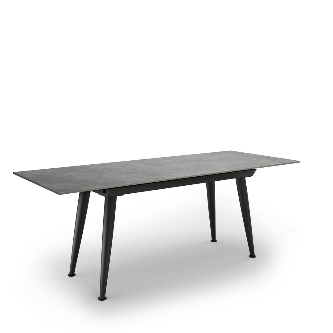 Modern extendable sintered stone dining table nieve in still life.