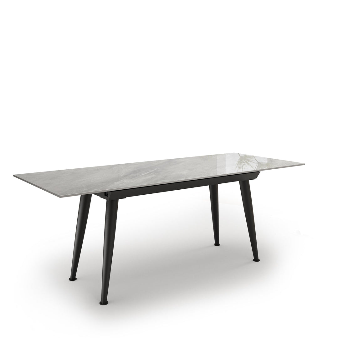 Modern extendable sintered stone dining table nieve conceptual design.