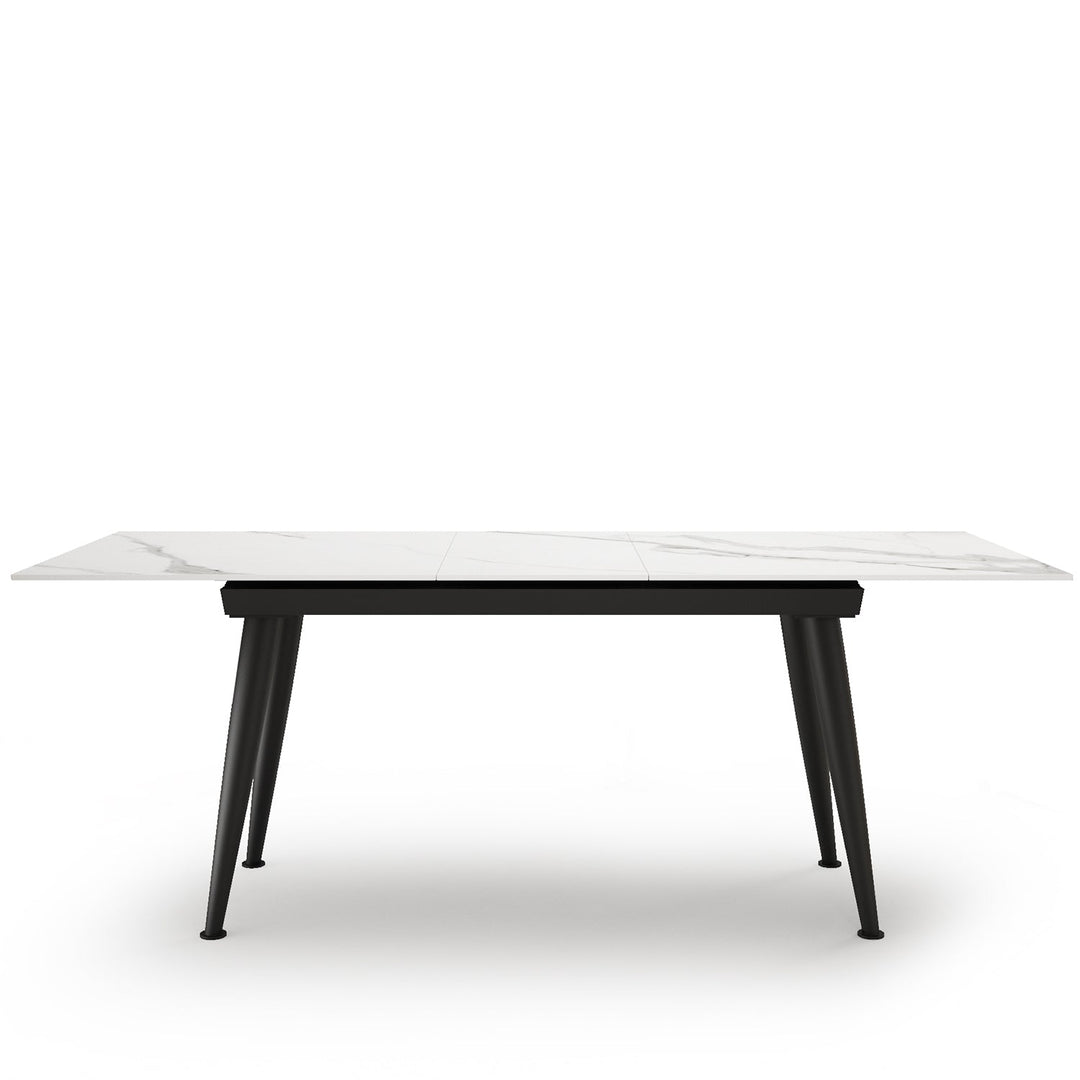 Modern extendable sintered stone dining table nieve in white background.