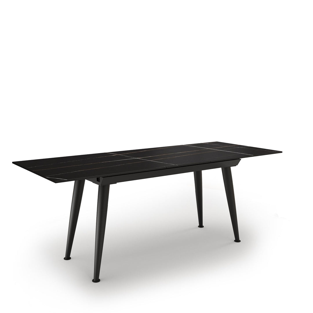 Modern extendable sintered stone dining table nieve in panoramic view.