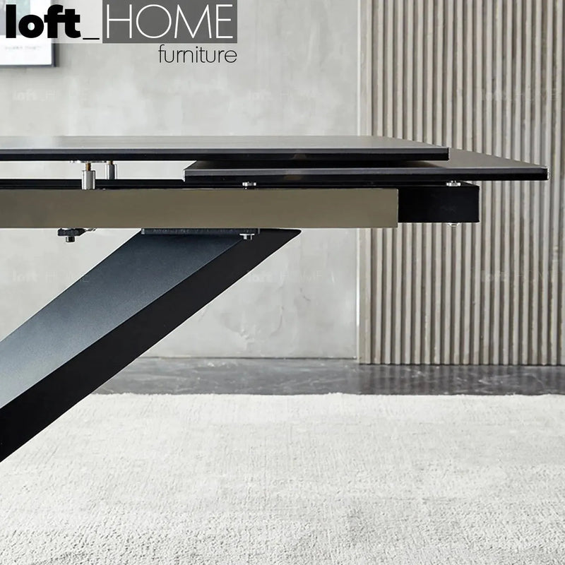 Modern extendable sintered stone dining table stratos with context.