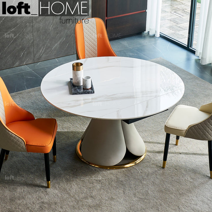 Modern extendable sintered stone round dining table petal primary product view.