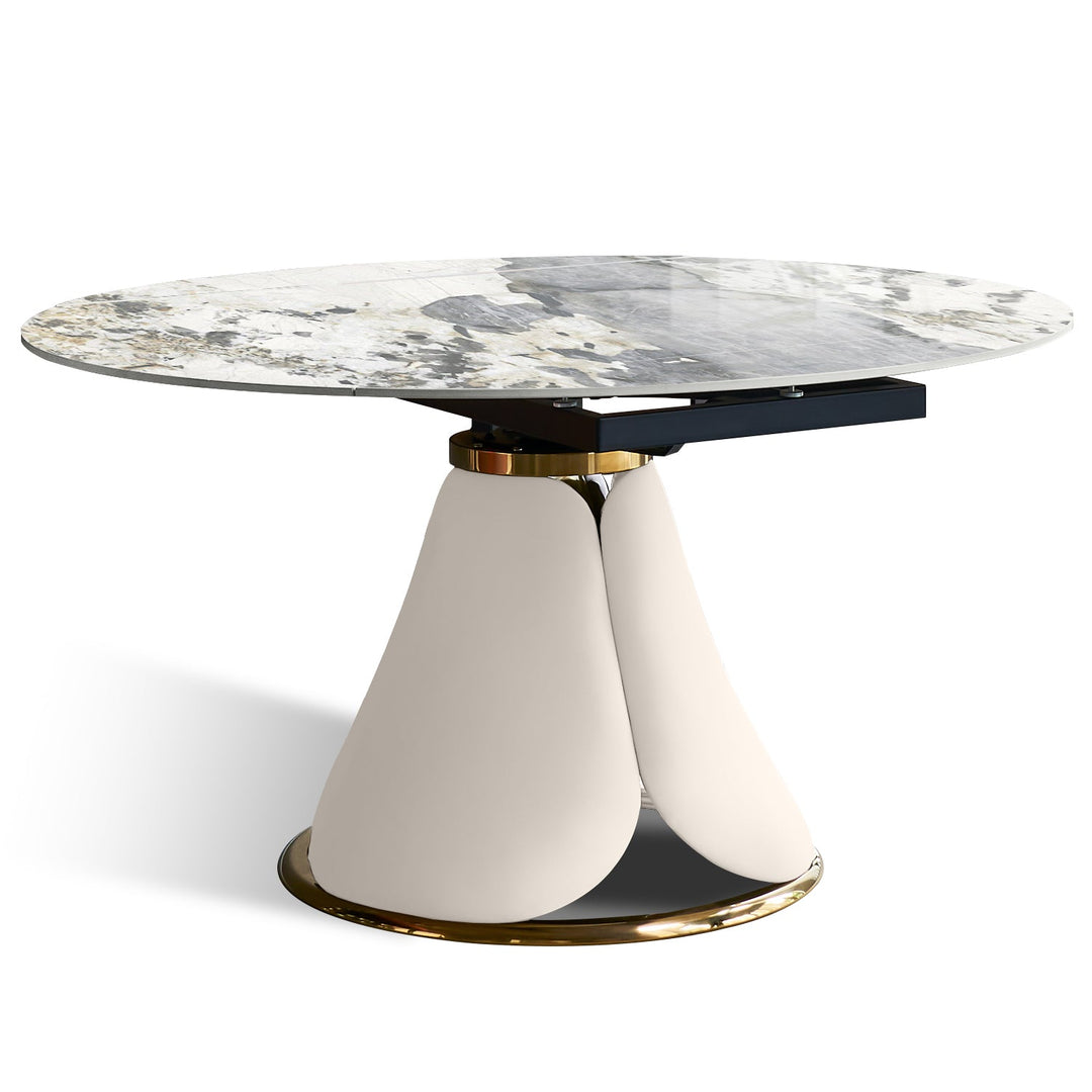 Modern extendable sintered stone round dining table petal layered structure.