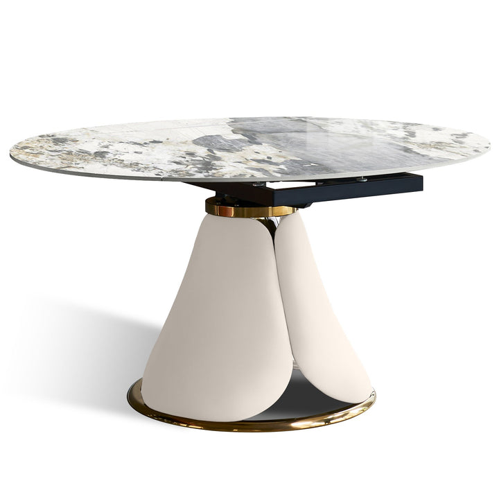 Modern extendable sintered stone round dining table petal layered structure.