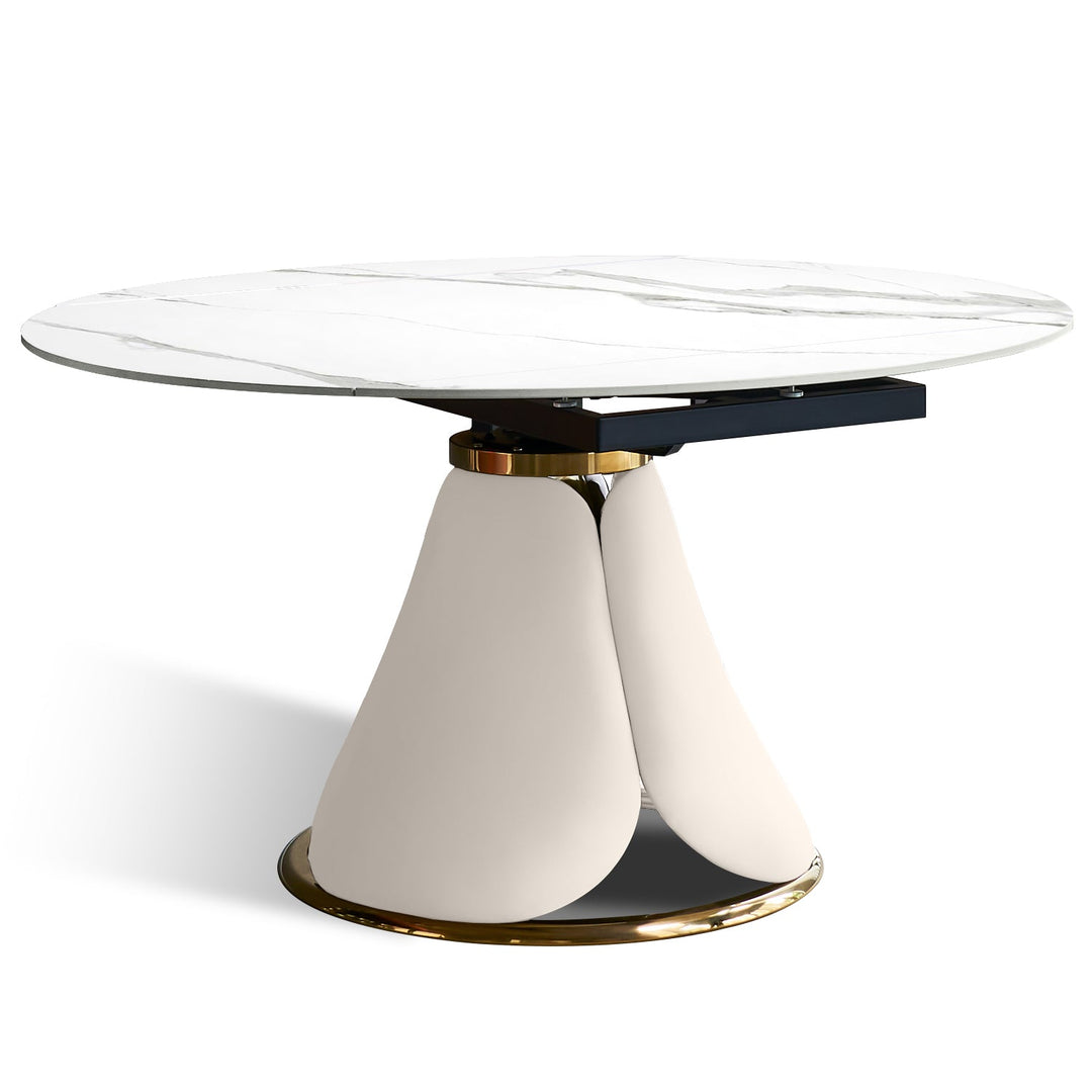 Modern extendable sintered stone round dining table petal in panoramic view.