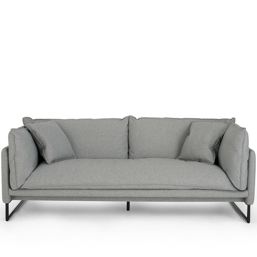 Modern fabric 3 seater sofa malini in white background.