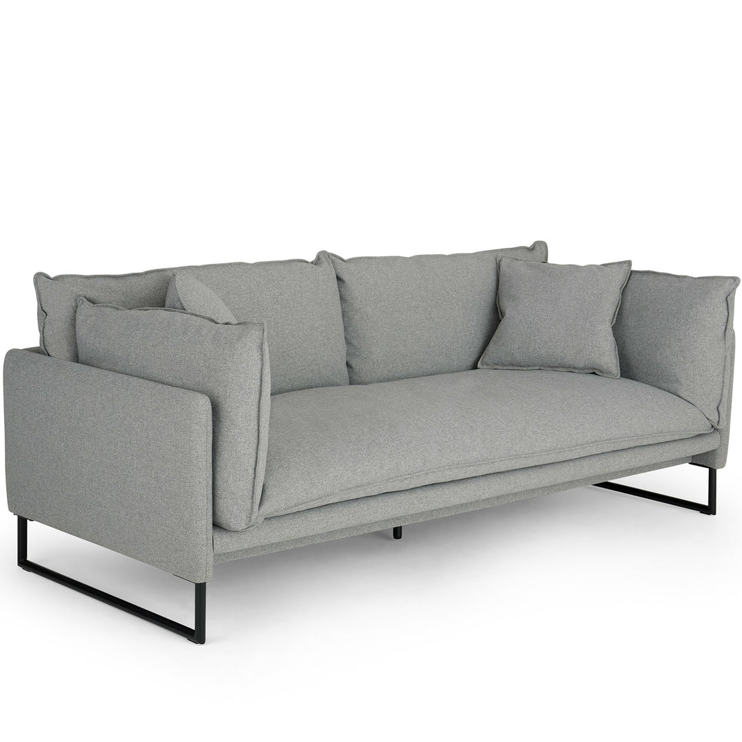 Modern fabric 3 seater sofa malini in still life.