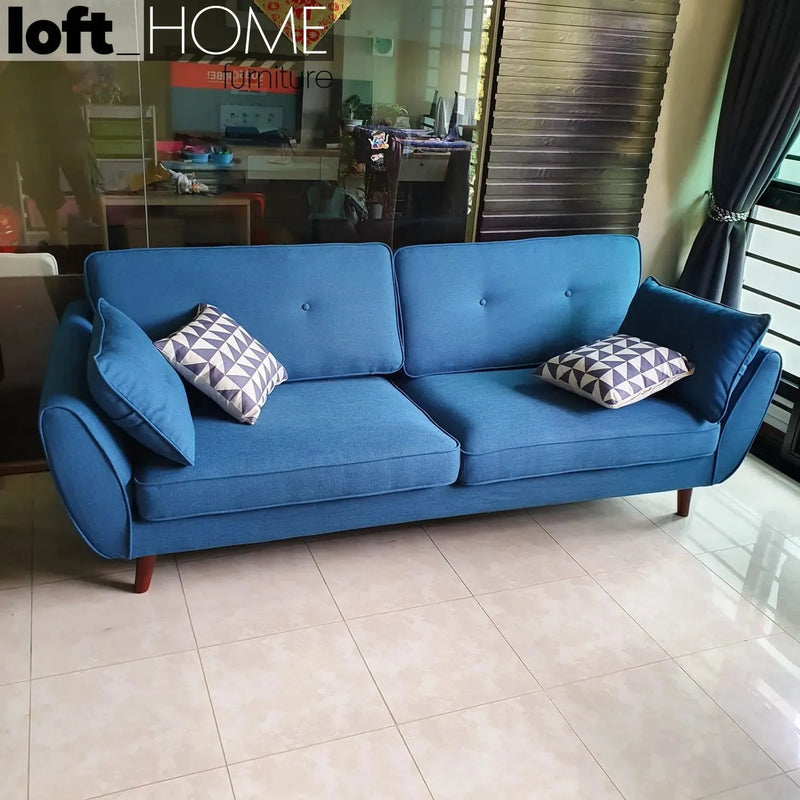 Modern fabric 4 seater sofa henri in still life.