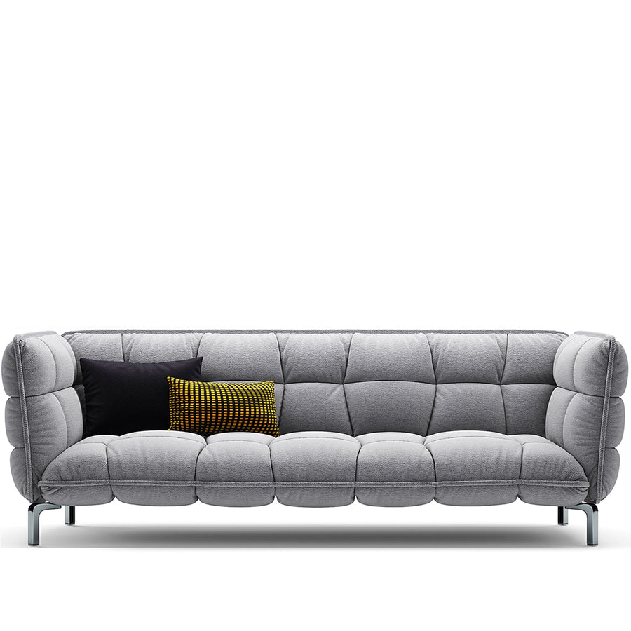 Modern fabric 4 seater sofa husk in white background.