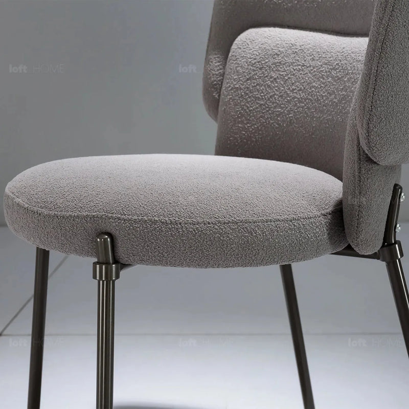 Modern fabric dining chair cloud in close up details.