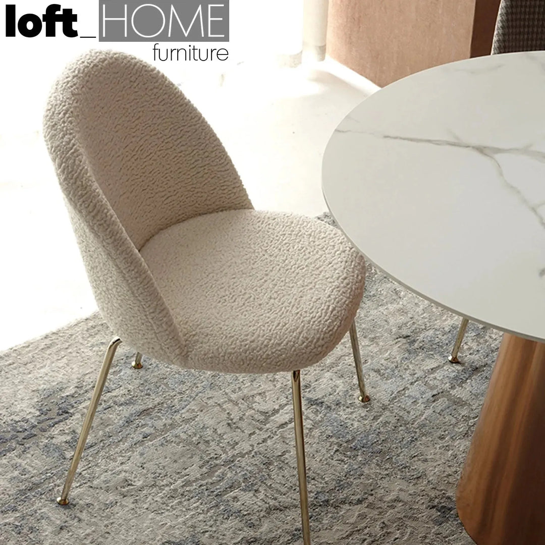 Modern fabric dining chair sheepskin with context.