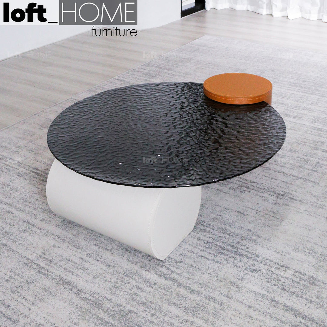 Modern fused glass coffee table verre particulier leather in details.