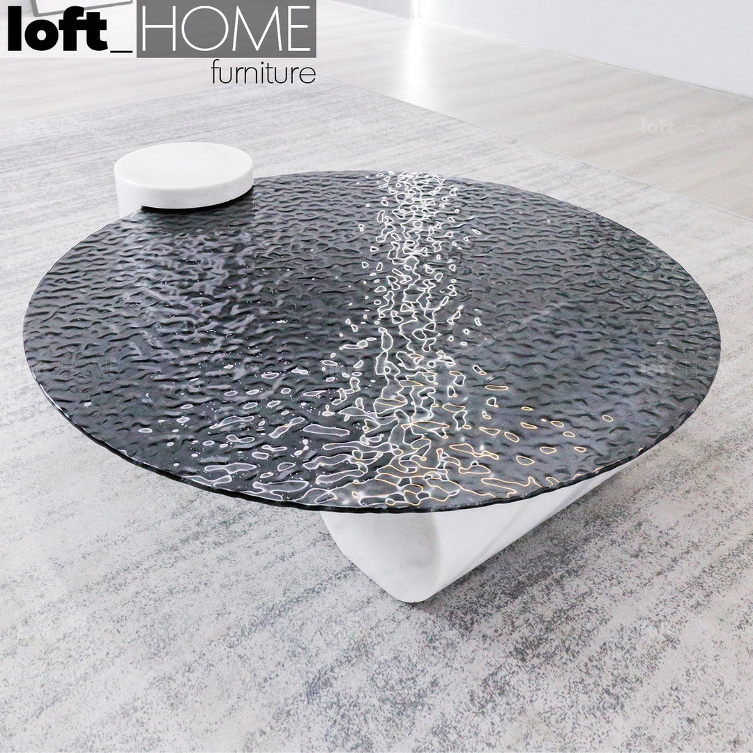 Modern fused glass coffee table verre particulier marble in real life style.