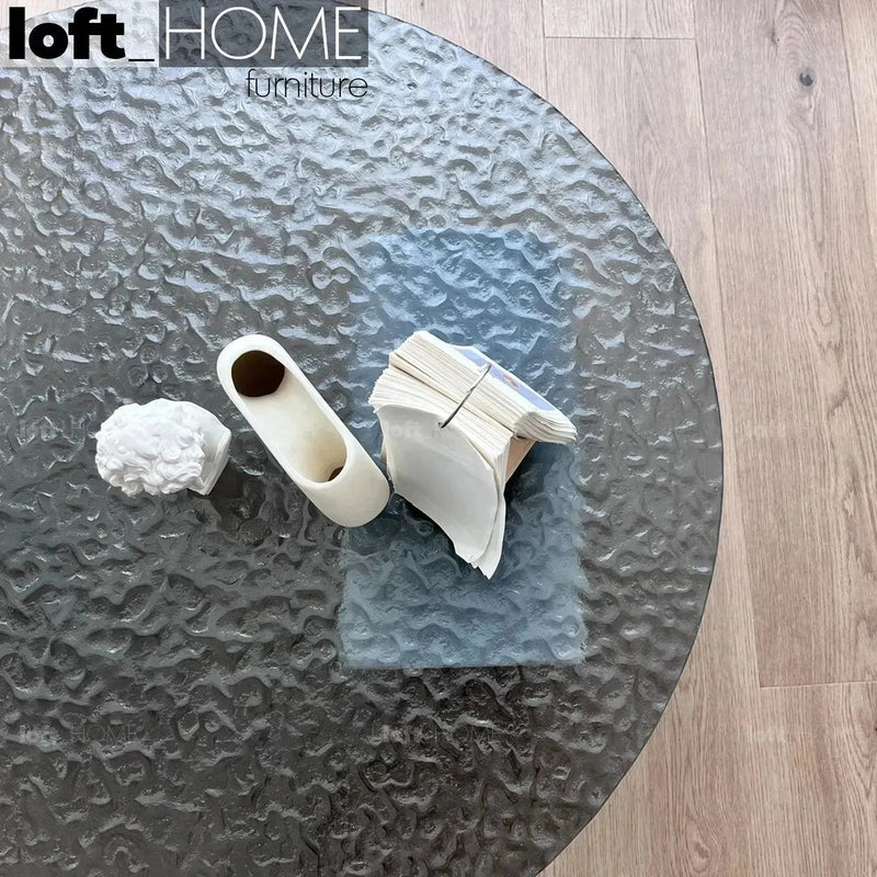 Modern fused glass coffee table verre particulier marble in close up details.