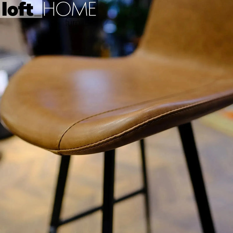 Industrial fabric and leather bar chair metal man in details.
