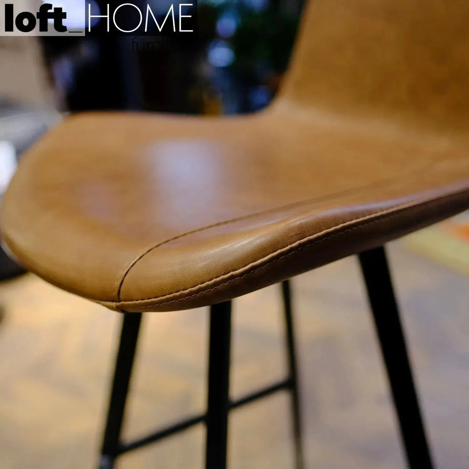 Industrial fabric and leather bar chair metal man in details.