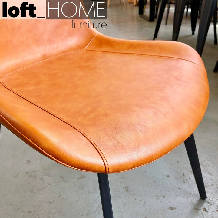 Modern leather dining chair metal man n1 in close up details.