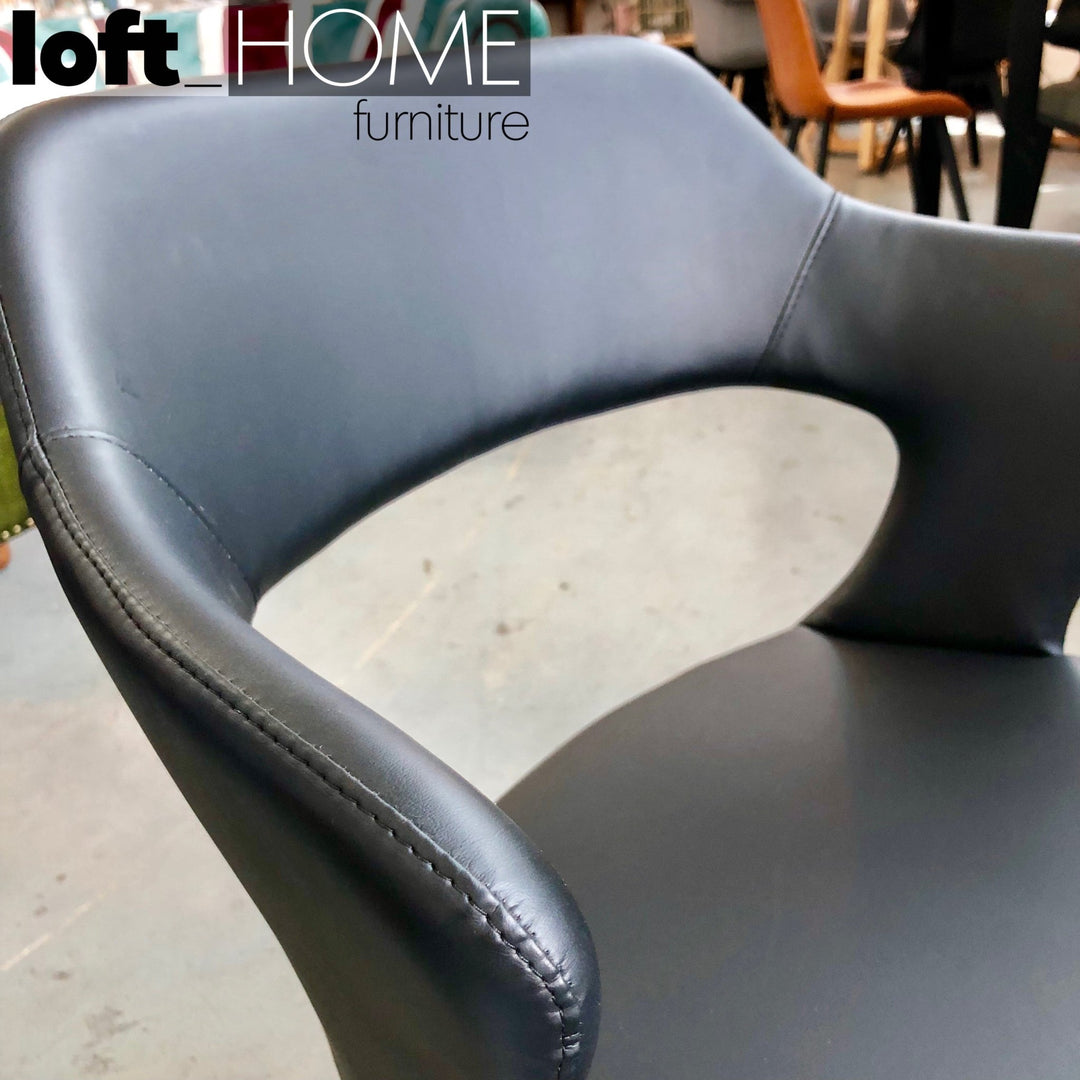 Modern leather dining chair metal man n2 in close up details.