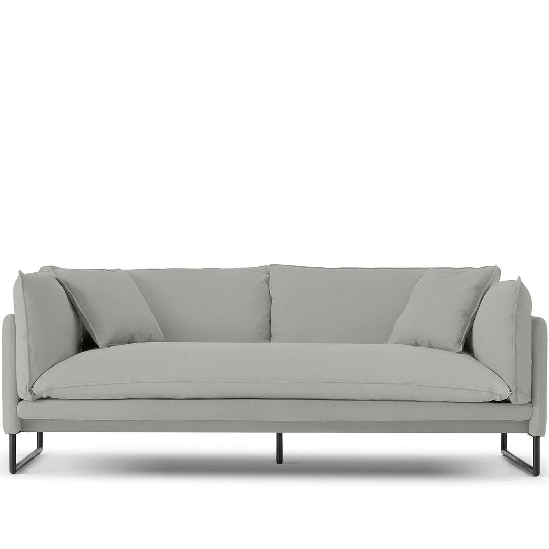 Modern linen 3 seater sofa malini in white background.