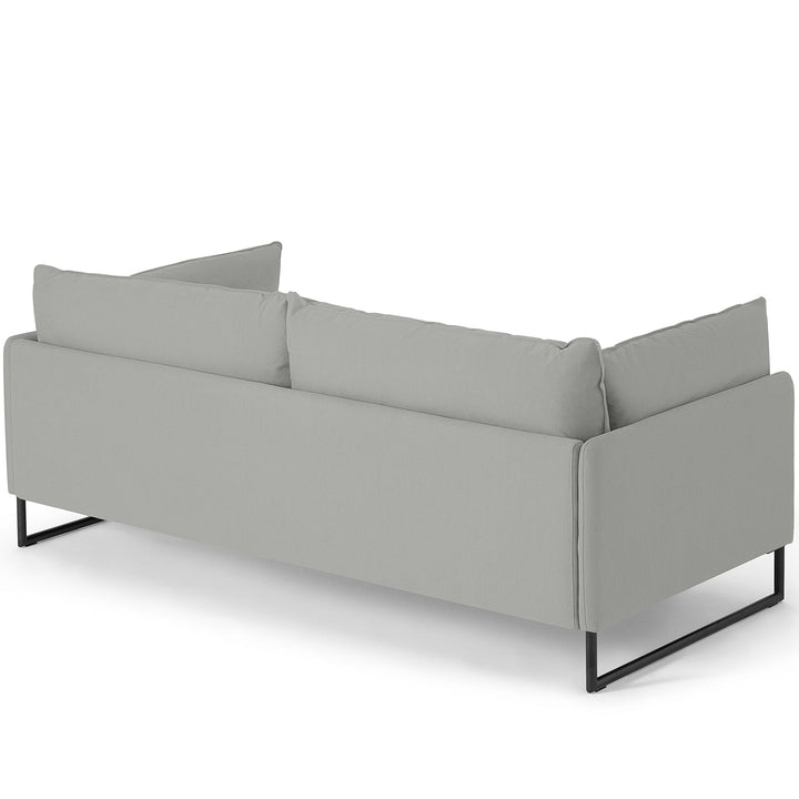 Modern linen 3 seater sofa malini in still life.