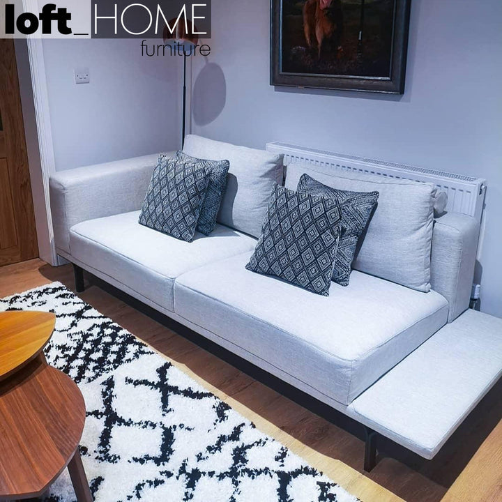 Modern linen 3 seater sofa with side table nocelle conceptual design.