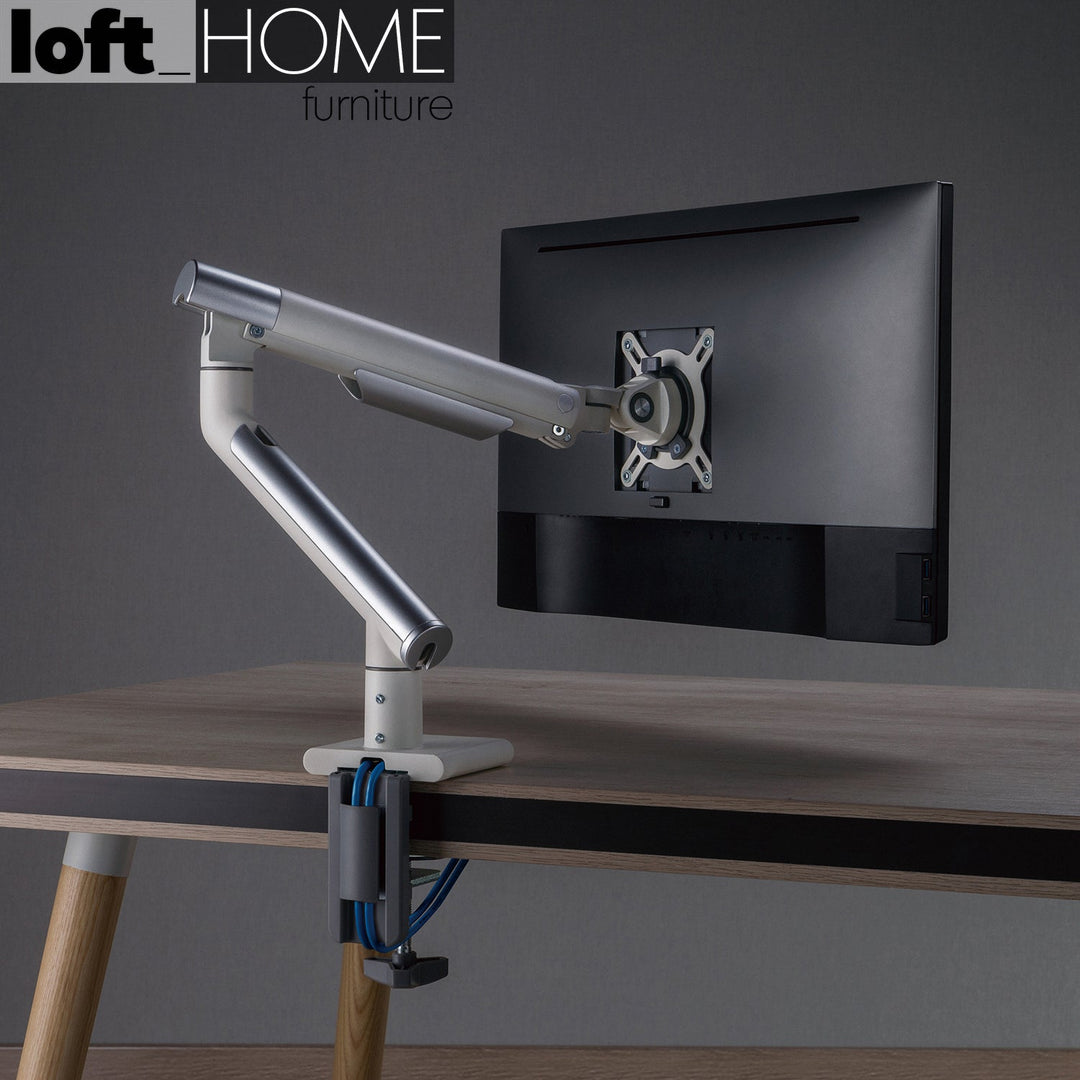 Modern metal single monitor premium slim aluminium spring-assisted monitor arm with usb ports in close up details.