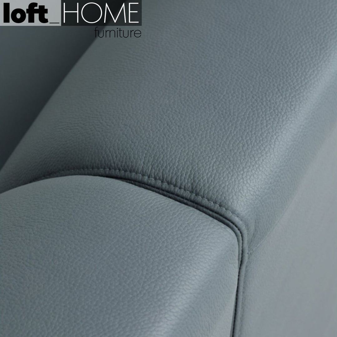 Modern microfiber leather 4 seater sofa beam in close up details.