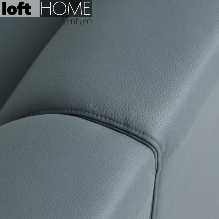Modern microfiber leather 4 seater sofa beam in close up details.