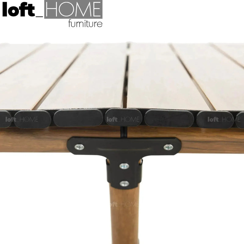 Industrial outdoor foldable coffee table rollie with context.