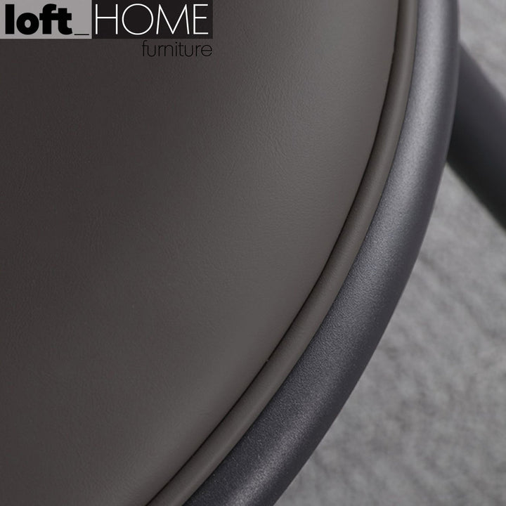 Modern pu leather dining chair dimgray in panoramic view.