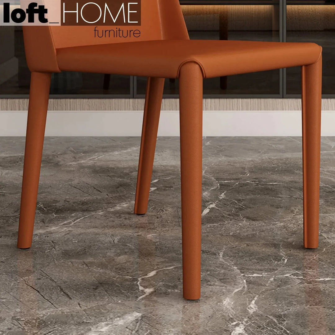 Modern pu leather dining chair orange in details.