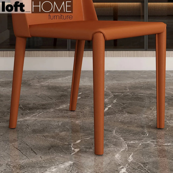 Modern pu leather dining chair orange in details.