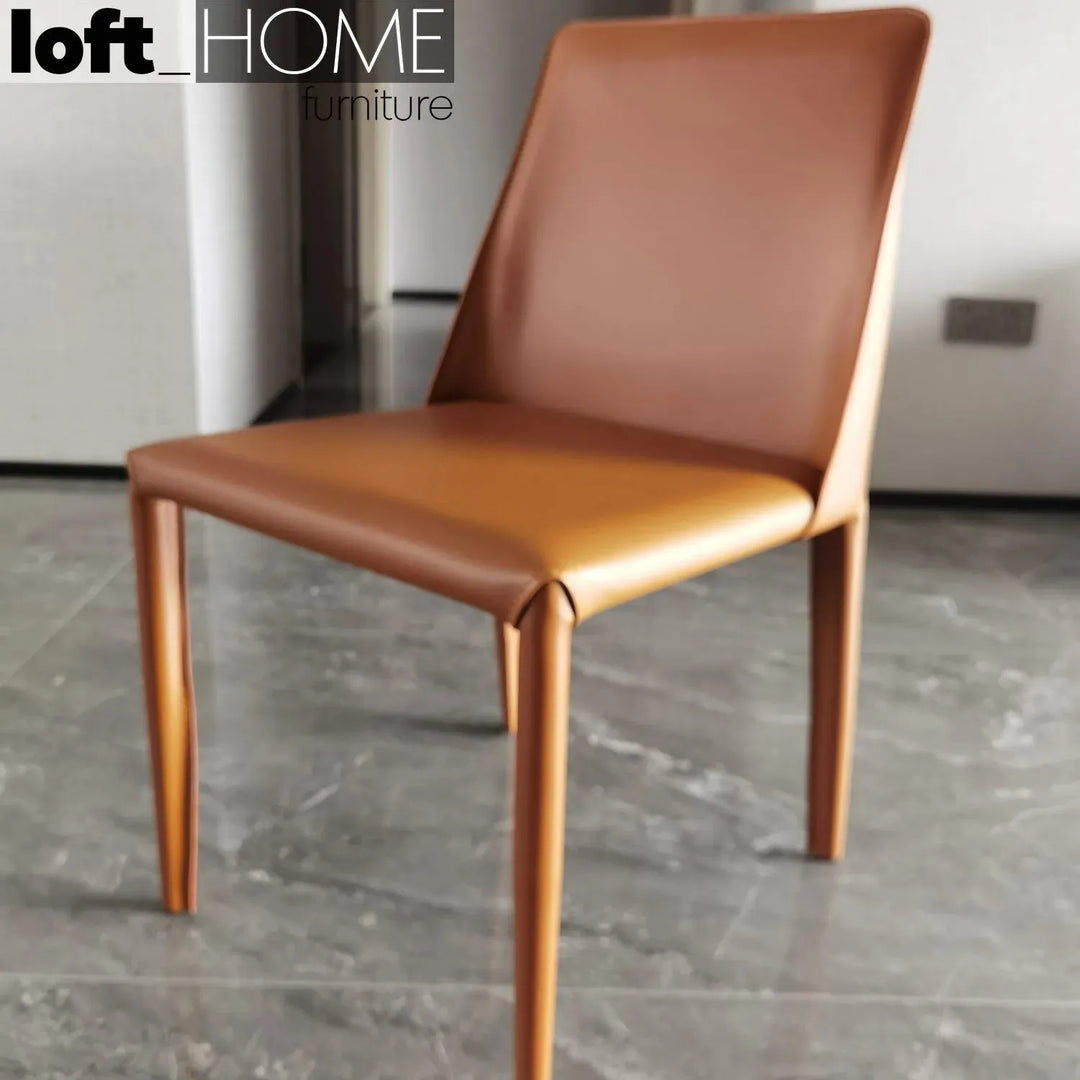 Modern pu leather dining chair orange in still life.