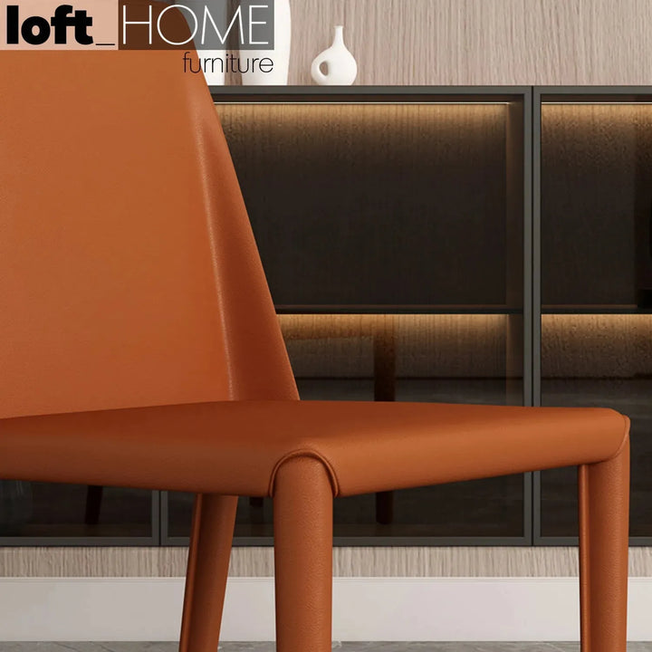 Modern pu leather dining chair orange in panoramic view.