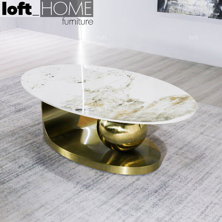 Modern sintered stone coffee table globe gold in close up details.