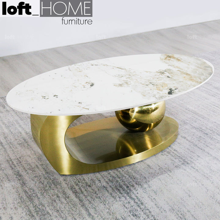 Modern sintered stone coffee table globe gold in details.