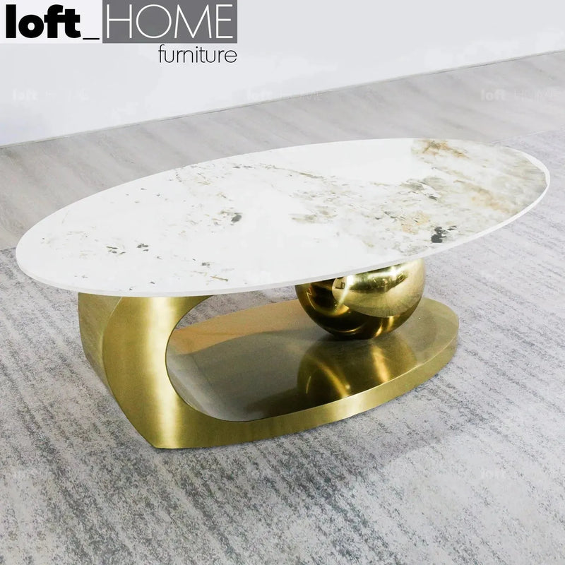 Modern sintered stone coffee table globe gold with context.