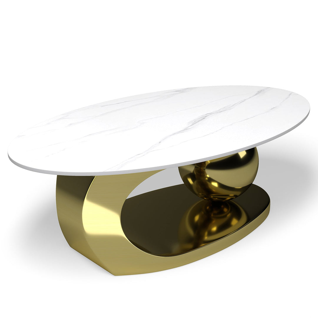 Modern sintered stone coffee table globe gold in still life.