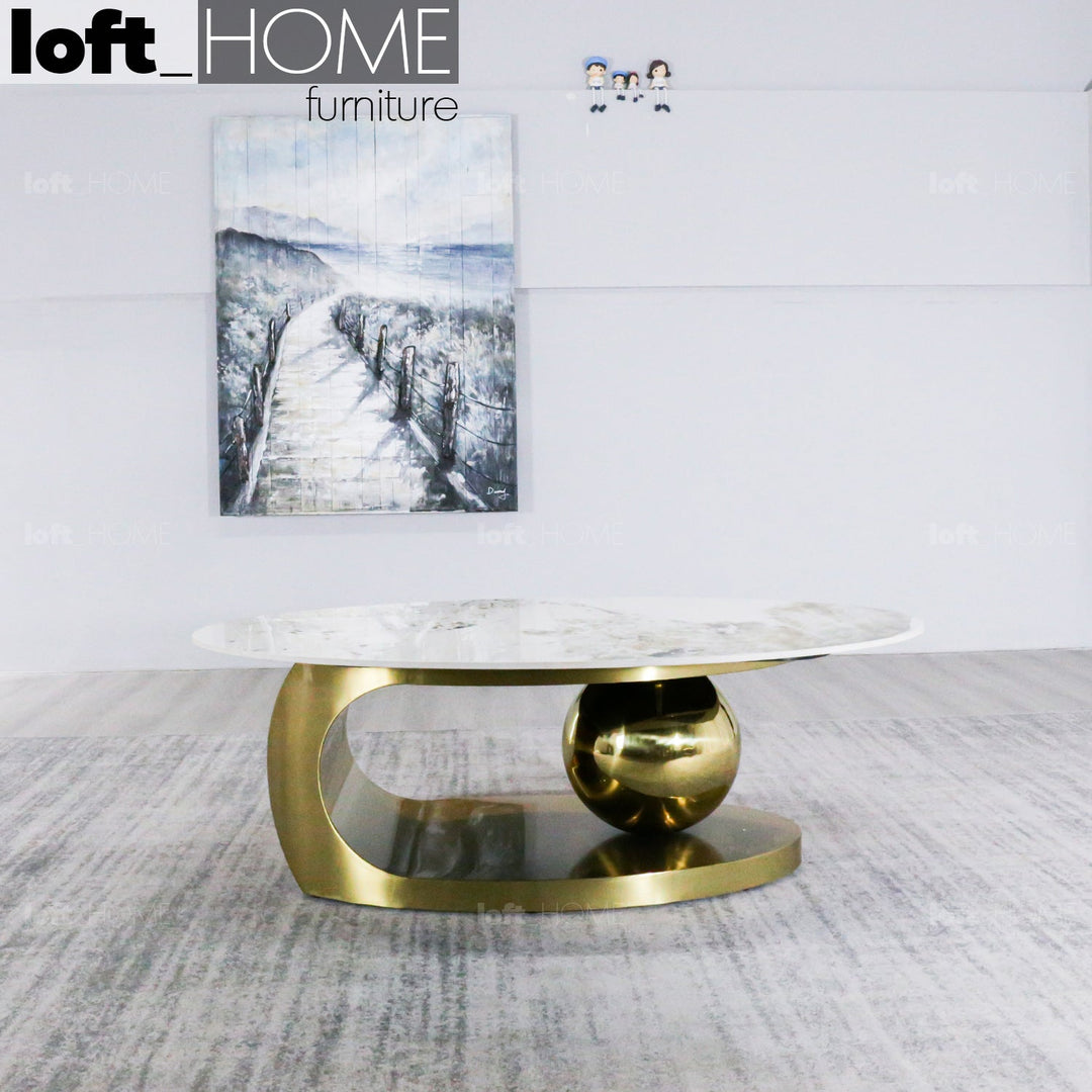 Modern sintered stone coffee table globe gold with context.