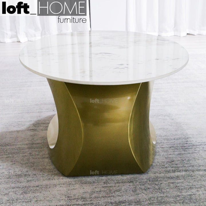 Modern sintered stone coffee table globe gold in panoramic view.