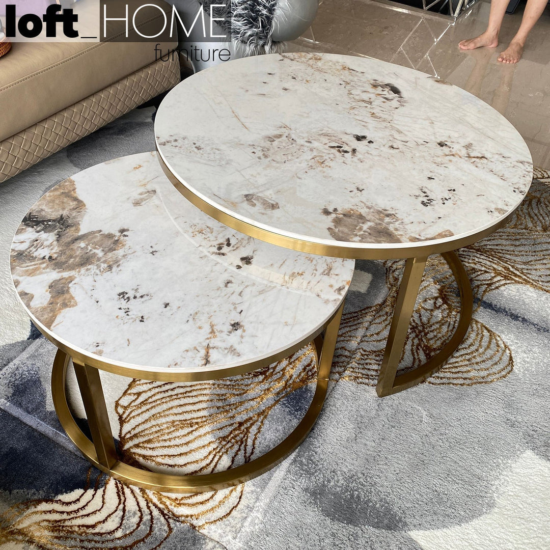 Modern sintered stone coffee table gold with context.